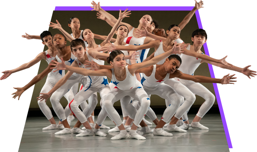 An ensemble of young performers on a stage wearing white unitards with red and blue stars gesture with their arms splayed to the side, showcasing a classic pose from Eliot Feld's "A Yankee Doodle."