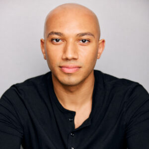 Headshot of John Manzari, Tap Instructor, looking straight at the camera.